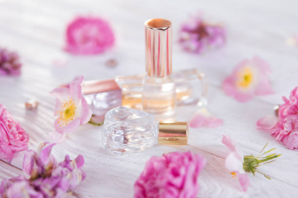 istock Bottles of perfume with flowers 692628128