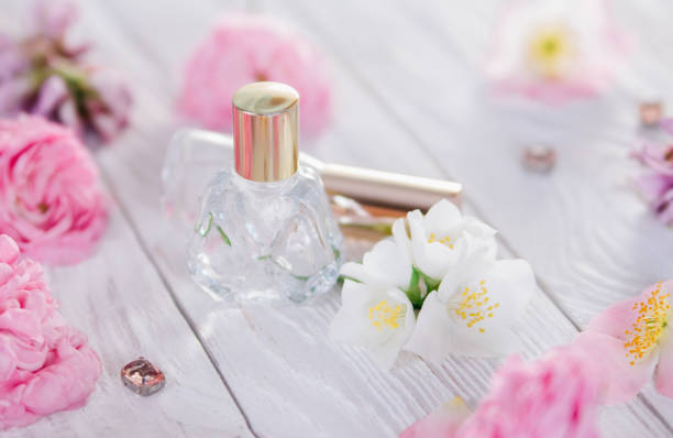 istock Bottles of perfume with flowers 692628530