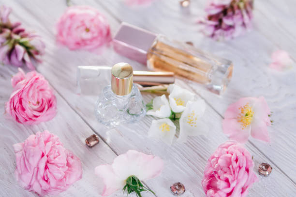 istock Bottles of perfume with flowers 692628584