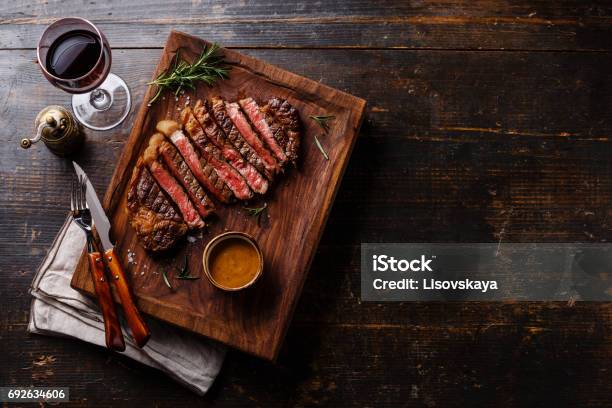 Grilled Sliced Steak Rib Eye With Pepper Sauce Stock Photo - Download Image Now - Steak, Wine, Barbecue - Meal