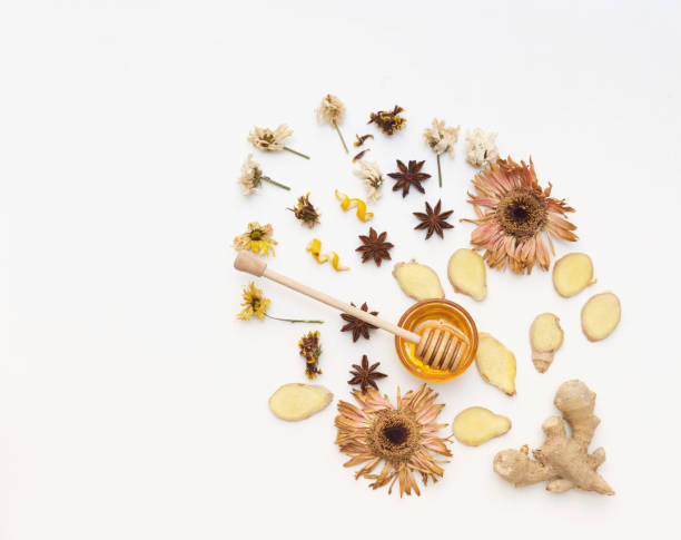istock Honey with  ginger over white background. Flat lay, top view, copy space 692635052