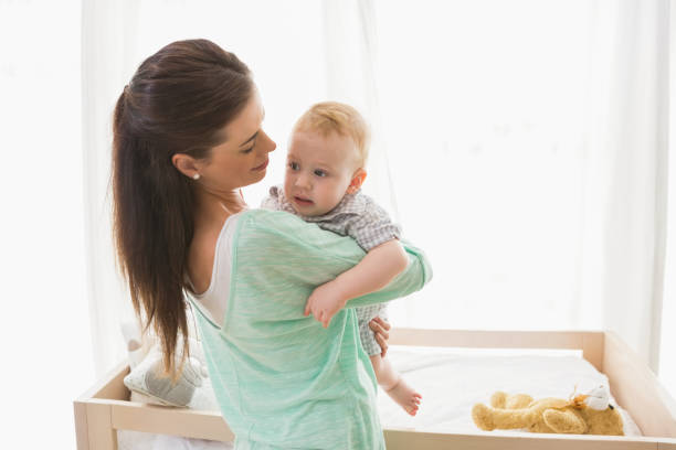 istock Happy mother with her baby boy 692638446