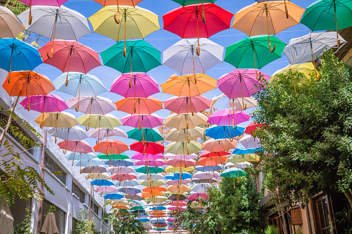 Lefkosa (Nicosia), Cyprus - September 11, 2016: People are spending time at Cafe at Arasta street in a sunny day under the colorfull umbrella.