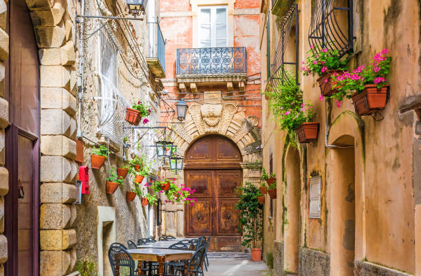 Cafe tables and chairs outside in old cozy street in the Positano town, Italy Cafe tables and chairs outside in old cozy street in the Positano town, Campania, Italy sorrento italy photos stock pictures, royalty-free photos & images