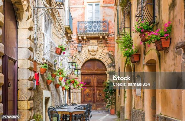 Cafe Tables And Chairs Outside In Old Cozy Street In The Positano Town Italy Stock Photo - Download Image Now