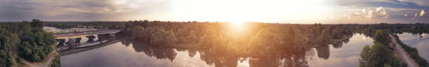 Aerial panoramic view of Adda river at sunset - South Adda Park