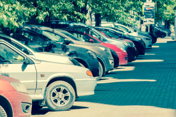 istock Car parking at the sidewalk a sunny day. 692647976