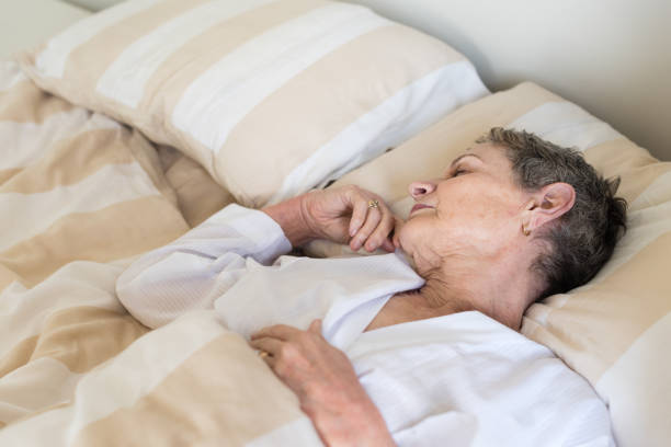 istock Elderly woman sleeping from above 692648088