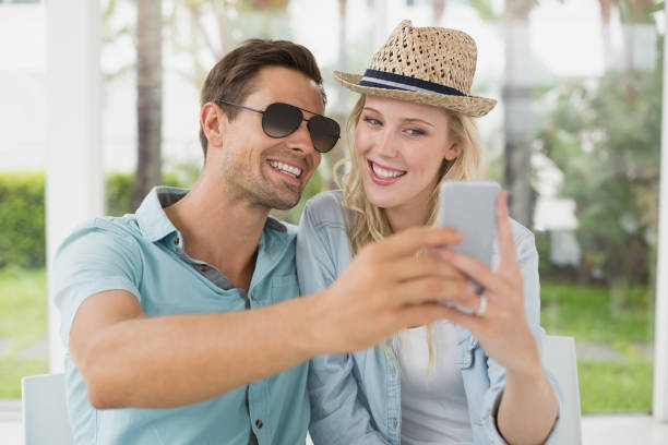 istock Hip young couple taking a selfie together 692655036