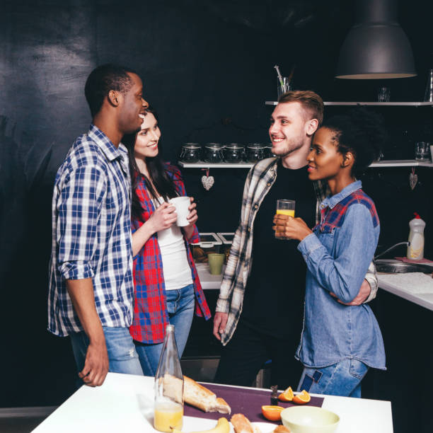 istock Company in kitchen, happy couples, communication 692657246