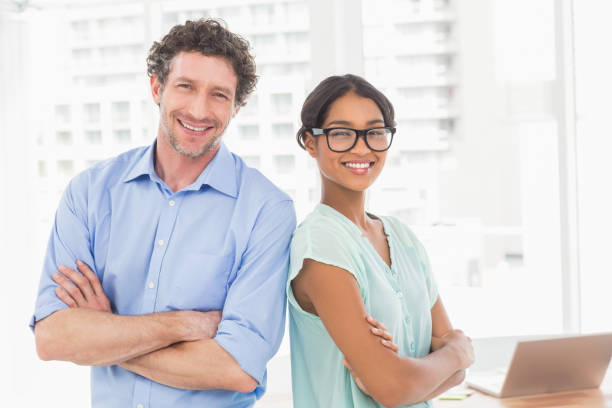 istock Casual business partners smiling at camera 692660688