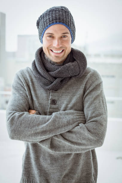 istock Handsome man in warm clothing smiling at camera 692661516