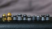Various kinds of airgun pellets in a line
