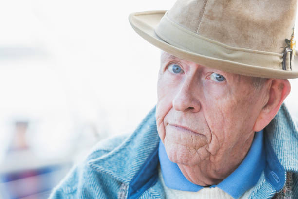 istock Face of serious senior man wearing a hat 692670204