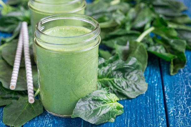 istock Detox green smoothie with spinach, pineapple, banana and yogurt, horizontal, copy space 692687360