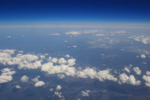 istock View of the land, fields, and clouds from above 692687536