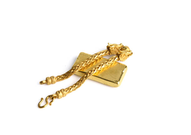gold chain and gold bar on a white background