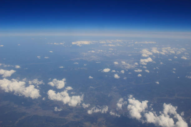istock View of the land, fields, and clouds from above 692688122