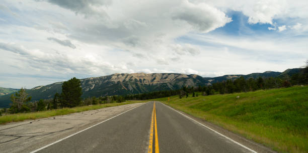 istock Open Road Mountain Background Journey Two Lane Blacktop Highway 692693684