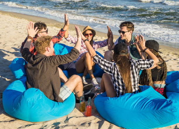 istock friends holding hands on the beach 692696460