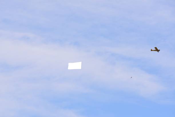 istock Airplane Towing Advertising Banner 692696520