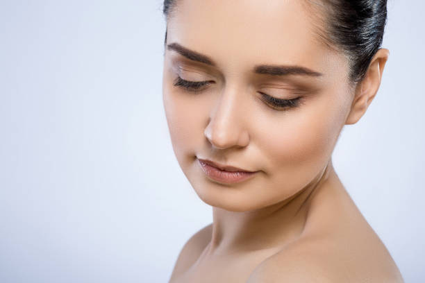 istock Beautiful girl with nude make up at studio 692701860
