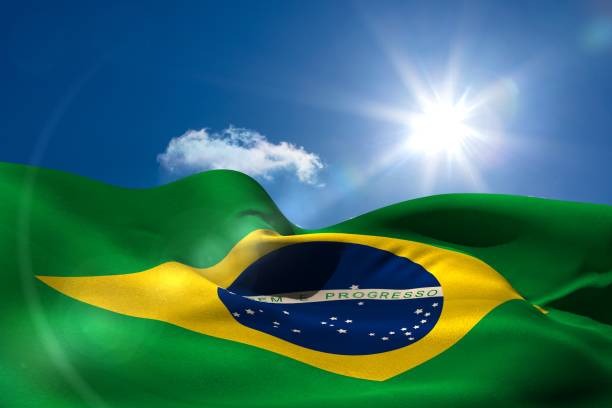 istock Brazil national flag under sunny sky 692701894