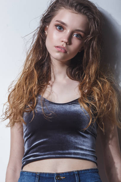 istock model girl tests portrait over dark background 692702218