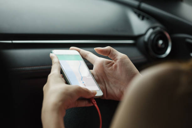 istock close-up woman using map app on phone mobile 692705402