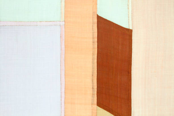 istock Patchwork background of ramie fabric stitched by hand. 692713780