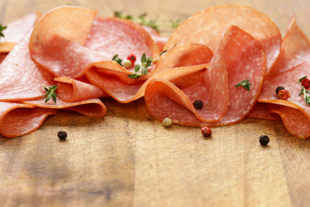 istock Sliced sausage salami with thyme and pepper 692714344