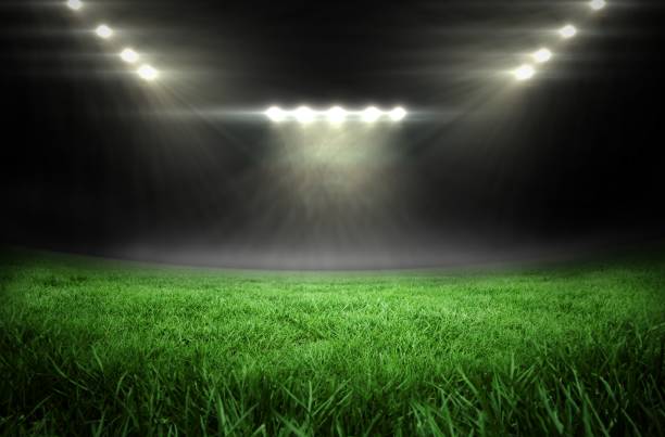 istock Football pitch with bright lights 692717444