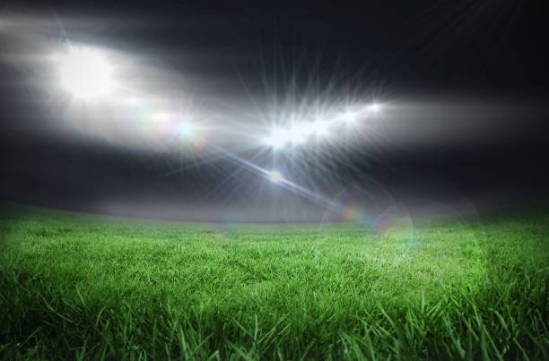 istock Football pitch under bright lights 692717476