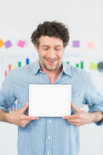 istock Happy casual businessman using tablet 692718216