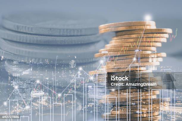 Double Exposure Of Stock And Profit Graph On Rows Of Coins For Finance And Banking Concept Stock Photo - Download Image Now