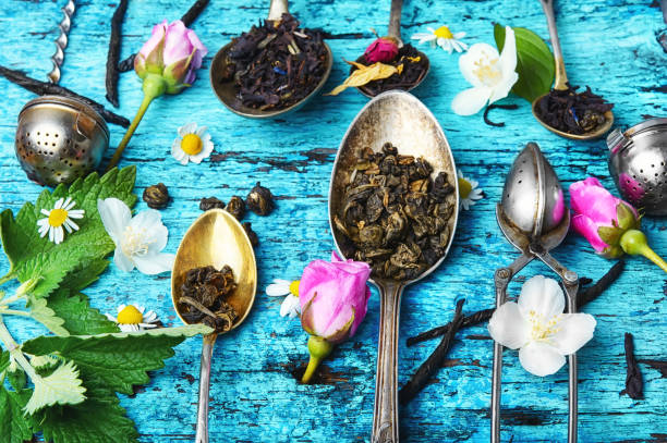 istock Tea spoons with tea leaves 692728790
