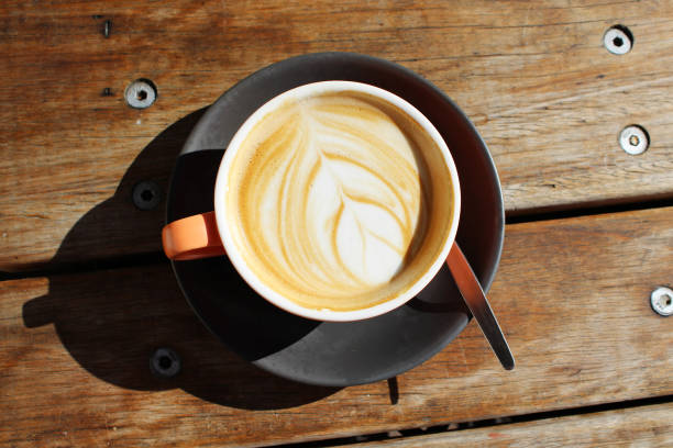 istock Fresh hot coffee on a wooden table 692731222