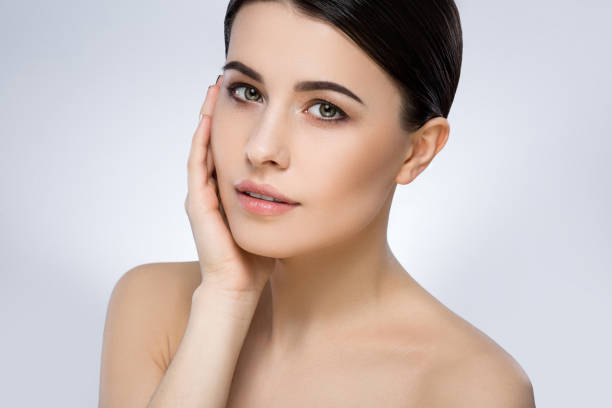istock Darkhaired girl with nude make up at studio 692739204