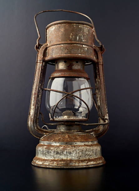 istock Kerosene oil lamp isolated on black background. 692741098