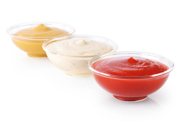 istock Bowls with ketchup mustard and mayonnaise isolated on white background. 692743530