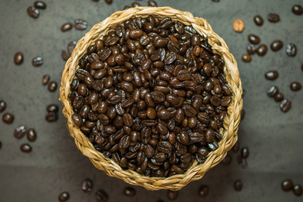 istock Coffee beans on basket. Focus on top. 692744016
