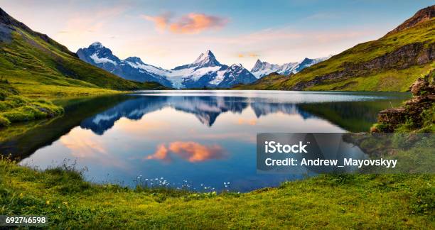 Wetterhorn And Wellhorn Peaks Reflected In Water Surface Of Bachsee Lake Stock Photo - Download Image Now