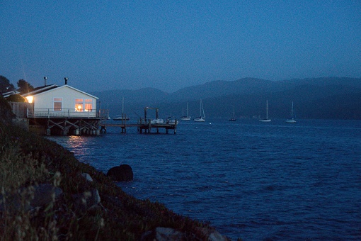 A nice view of a boat dock during the end of a sunset on tomales bay.