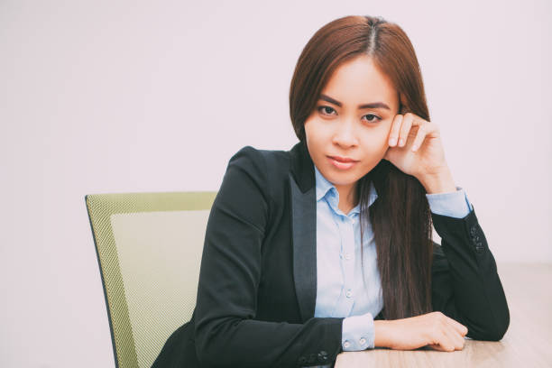 istock Confident Asian business lady leaning on hand_tone 692758540