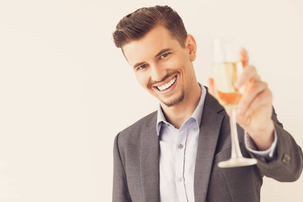 uomo d'affari felice con flauto che celebra success_tone - party business toast champagne foto e immagini stock