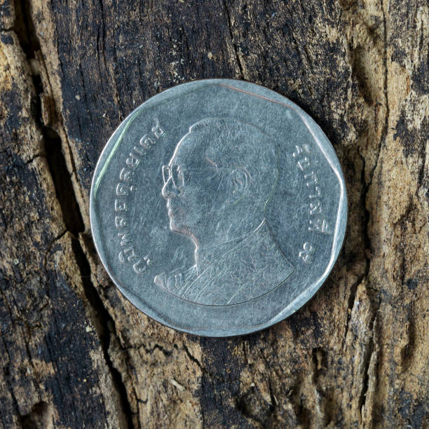 istock Thai Coin on wooden background. 692759020