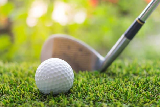 istock Golf club and ball on green grass 692767832