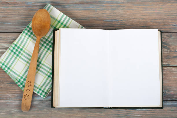 istock open recipe book on wooden background 692772202