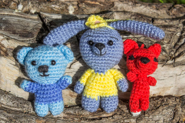 istock Toy teddy bear, fox and hare on a branch of a tree 692778496