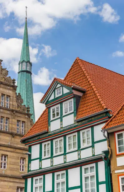 Colorful facade and church tower in Hameln, Germany